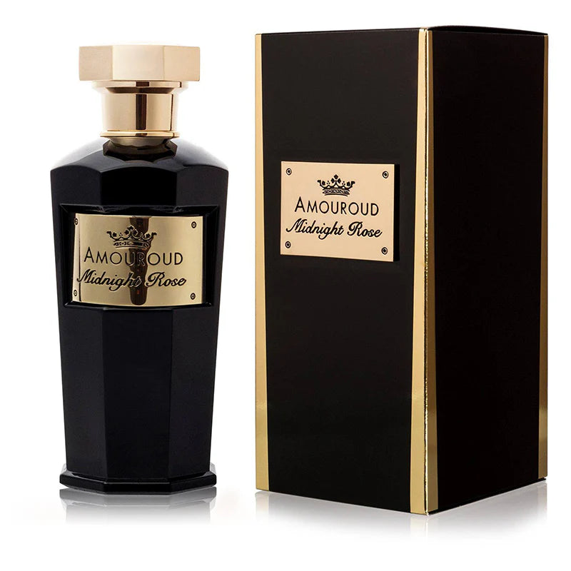 A black Amouroud Midnight Rose Eau De Parfum bottle elegantly sits beside its matching box, both featuring gold labels and accents.