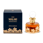 A 12ml bottle of Swiss Arabian Oud Malaki oil with a gold base sits beside its stylish dark blue and gold packaging.
