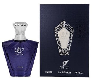 Afnan Turathi Homme Blue 90ml Eau De Parfum by Afnan is displayed in a blue bottle with a silver cap alongside its matching box, both featuring elegant silver designs and text, showcasing this bold men’s fragrance.