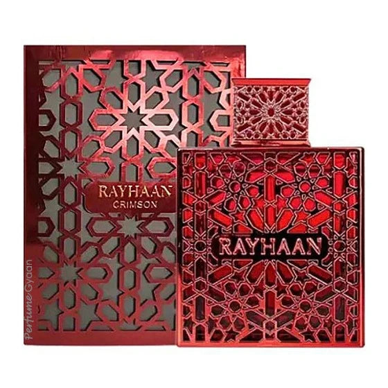 A vibrant red Rayhaan Crimson 100ml EDP perfume bottle and its matching box, both adorned with intricate geometric patterns and the “Rayhaan Crimson” label on the front, perfectly capture the essence of this warm and spicy men’s fragrance from Rayhaan.