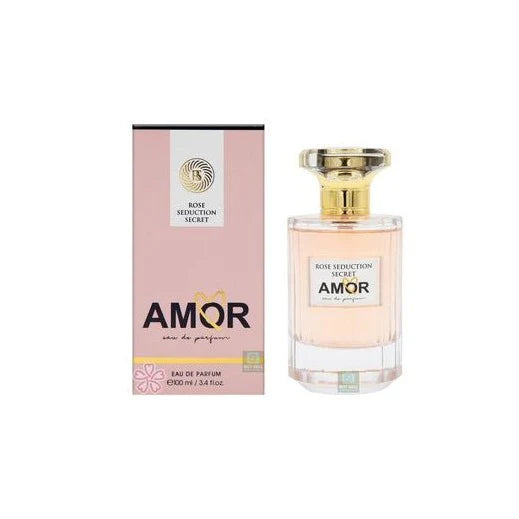 A bottle of Fragrance World Amor Rose Seduction Secret 100ml EDP by Rio Perfumes stands next to its pink and gold box—a floral women’s fragrance that adds elegance to any collection.