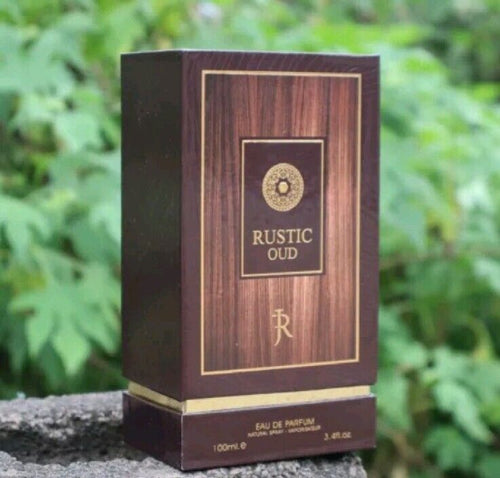 A bottle of Jacques Richmond Rustic Oud 100ml Eau De Parfum by Rio Perfumes sitting on top of a tree.