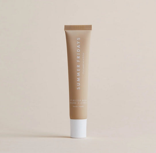 A tube of Summer Fridays Lip Butter Balm Vanilla by Summer Friday stands upright on a light beige background.