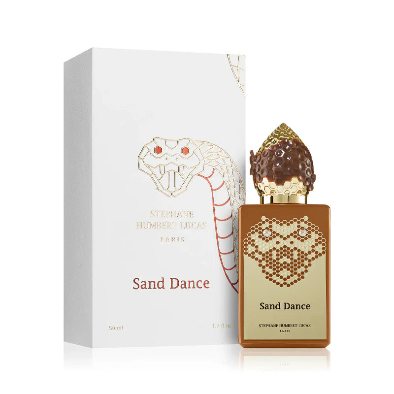 The Stéphane Humbert Lucas 777 Snake Collection Sand Dance 50ml EDP features a gold, snake-patterned bottle and box with a cobra motif, reflecting the brand's elegant Oriental Vanilla scent.