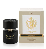 A black bottle of Tiziana Terenzi Nero Oudh 100ml Extrait De Parfum is shown beside its beige and gold box, showcasing this luxurious unisex fragrance by Tiziana Terenzi.