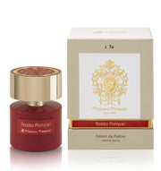 A red bottle of Tiziana Terenzi Rosso Pompei 100ml Extrait De Parfum stands by its beige-and-gold box, featuring the Tiziana Terenzi logo and product name—a unisex luxury fragrance.
