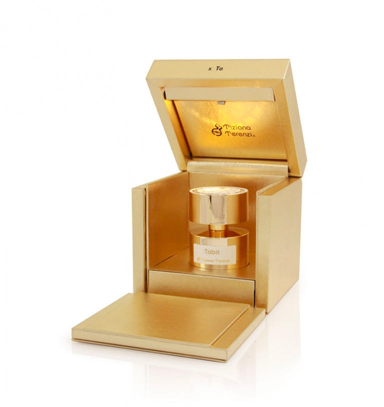 A gold Tiziana Terenzi Tabit 100ml Extrait De Parfum bottle is displayed in an open, gold-tone box with a hinged lid and interior lighting.
