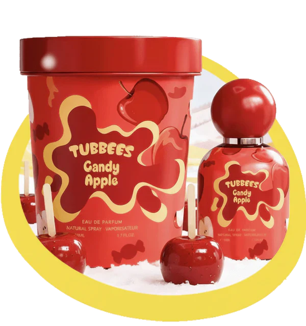 Tubbies Candy Apple EDP perfume bottle and container feature a candy apple design, surrounded by candy apples and highlighted by a yellow ring in the background. Experience the irresistible Tubbies Candy Apple Eau de Parfum—a unisex gourmand fragrance that perfectly captures the luscious essence of candy apples with every spritz.