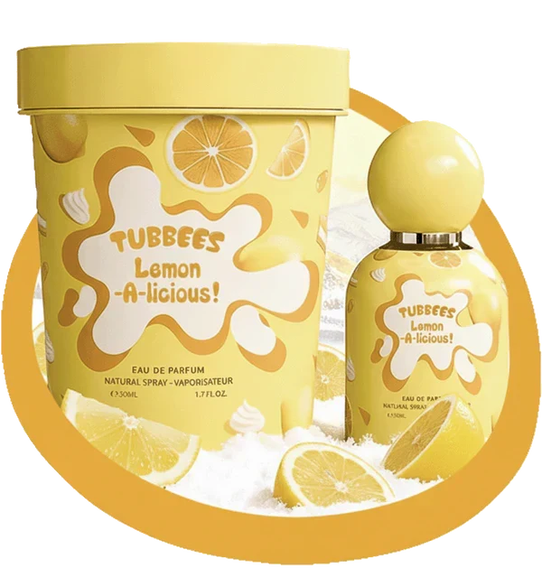 The Tubbees Lemon-A-Licious EDP bottle and box are displayed alongside lemon slices against a white background, highlighting the vibrant appeal of this unisex citrus fragrance from Tubbees. Experience how Tubbees Lemon-A-Licious Eau de Parfum delivers a zesty yet gourmand scent journey, making it an ideal choice for any occasion.