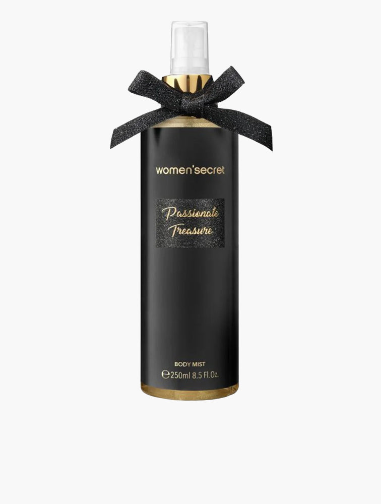The Women Secret Passionate Treasure 250ml Body Mist features an alluring floral fruity fragrance, with a black label, gold accents, and a decorative black bow at the neck.