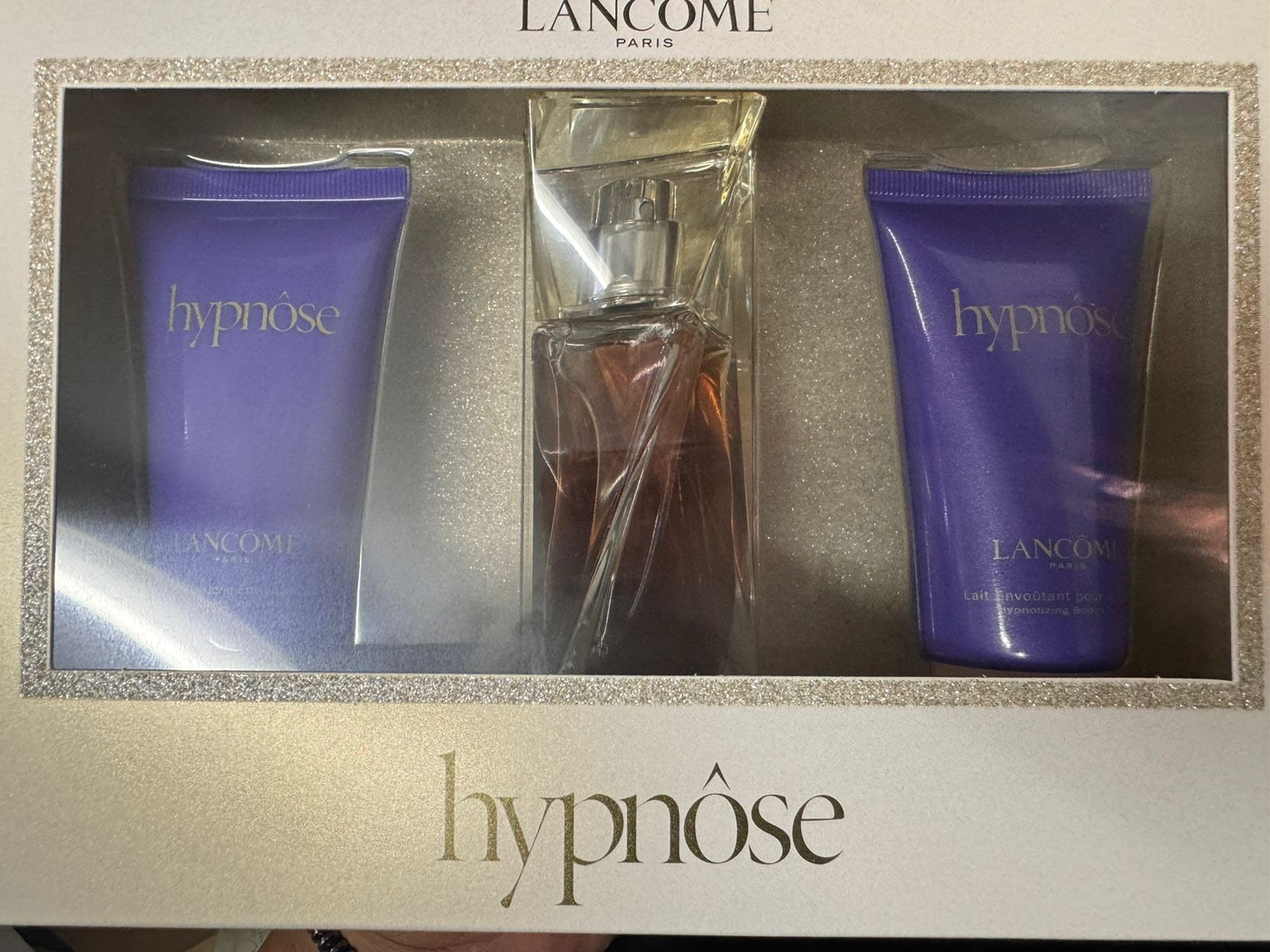The Lancôme Hypnose 30ml EDP Gift Set includes two purple tubes and a perfume bottle, beautifully arranged in a white box with gold accents—a luxurious women's fragrance gift.