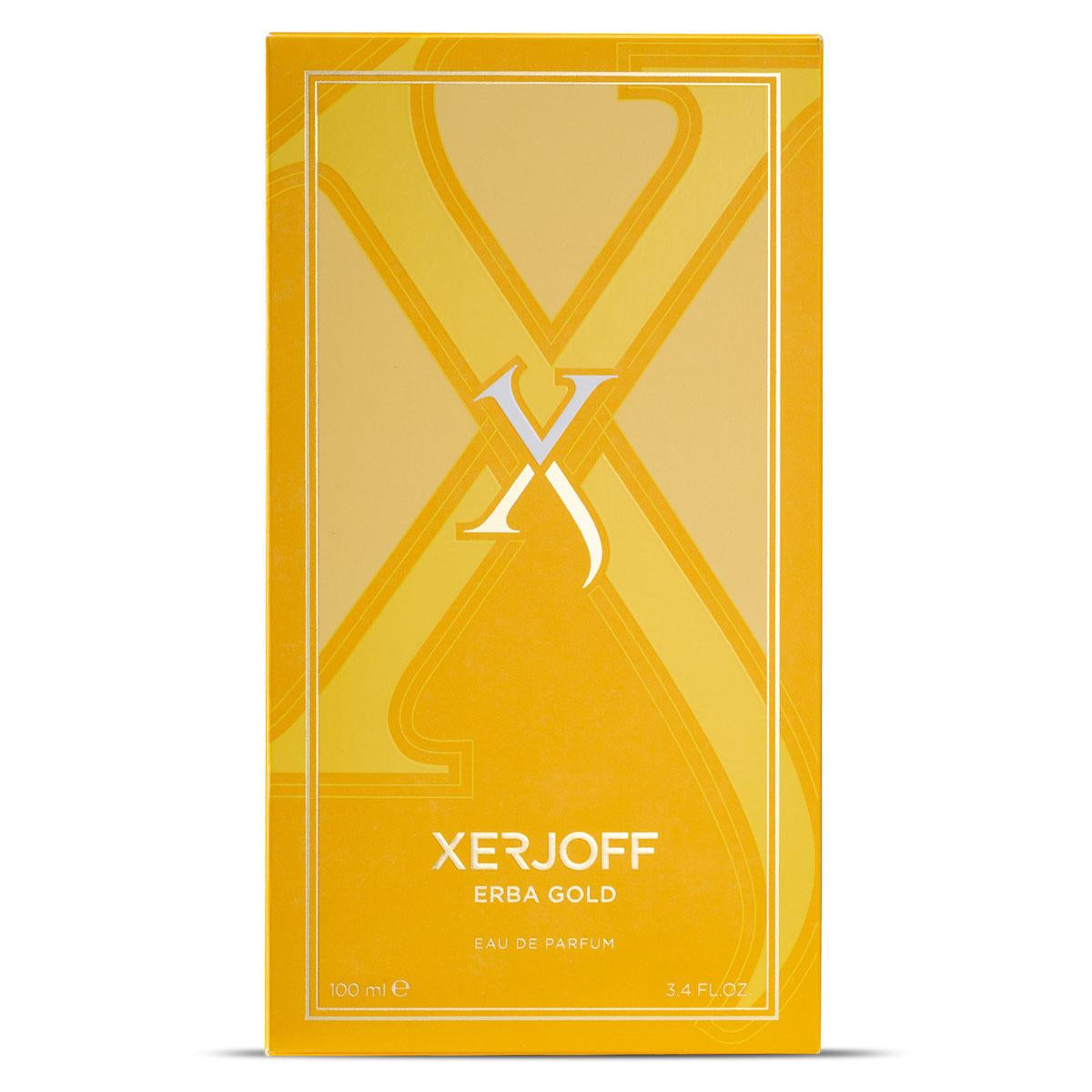 A yellow box of Xerjoff Erba Gold 100ml, featuring a prominent 'X' design, elegantly displays the brand and fragrance details, resembling an artfully wrapped silk neck scarf.