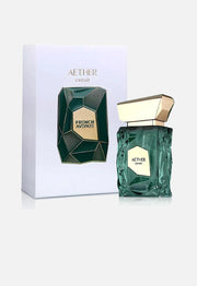 A green, geometric bottle of French Avenue Aether 100ml Extrait De Parfum stands beside its matching box on a plain background, reflecting the elegance of this aromatic fruity fragrance by French Avenue.