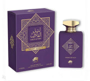 A purple perfume box and matching bottle labeled “Al Fares Lailat Al Fares Night Effect” by Al Fares, adorned with gold Arabic and English text and designs. The bottle features a gold cap, contains 100 ml of Eau De Parfum, and offers a captivating Amber Vanilla fragrance.