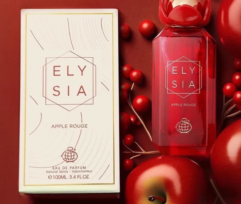 A striking red bottle of Fragrance World’s Elysia Apple Rouge 100ml EDP stands gracefully next to its box. The vivid composition, arranged on a coordinating red surface, features ripe apples and berries—capturing the essence of this fruity-floral fragrance.