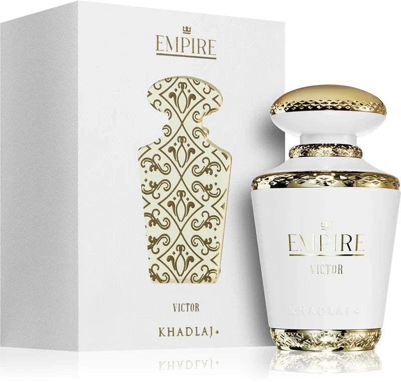 The Khadlaj Empire Victor 100ml EDP, a luxurious unisex fragrance by Khadlaj, is presented in a white and gold bottle beside its matching decorative box with gold patterns.