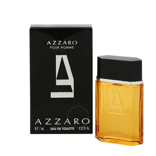 The Azzaro Pour Homme miniature 7ml Eau De Toilette bottle and its box present a sophisticated allure. The amber-colored bottle, topped with a black cap, exudes timeless elegance, while the sleek black box adorned with white text and logo completes this classic fragrance for men.