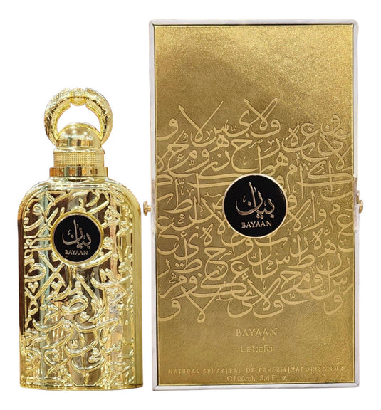A golden Lataffa Bayaan 100ml Eau De Parfum bottle with intricate metalwork next to its matching ornate gold box, both adorned with Arabic script and the logo "Lattafa Bayaan.
