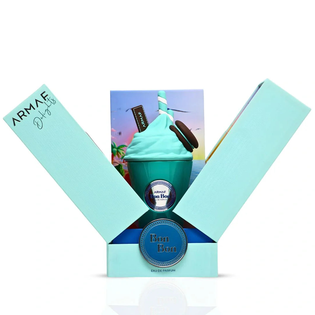 A turquoise perfume bottle shaped like a whipped cream dessert, with a straw and chocolate pieces, is displayed in an open light blue box labeled "Armaf Delights Bon Bon 100ml EDP" by Rio Perfumes, capturing a playful floral fruity gourmand vibe.