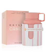 A pink and white Armaf Odyssey Candee 100ml EDP bottle is displayed beside its matching box, highlighting this distinctive fragrance by Armaf.