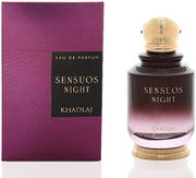 A 100ml bottle of Khadlaj Sensuous Night sits beside its purple and black box, showcasing this captivating unisex fragrance from Khadlaj.