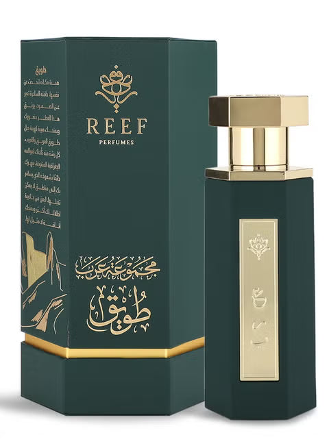A dark green and gold Reef Arab Collection Tuwayq 100ml EDP bottle stands beside its matching box, both adorned with Arabic calligraphy—a luxurious unisex Eau De Parfum by Reef.