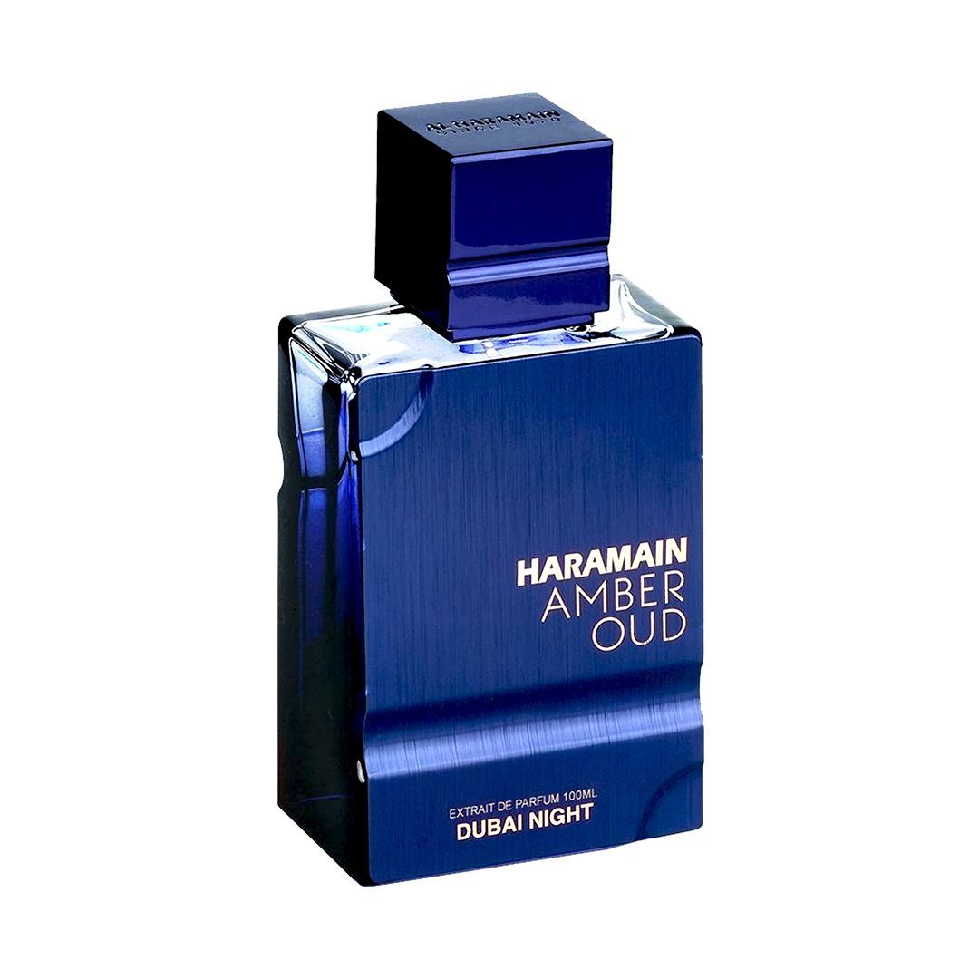The AL Haramain Amber Oud Dubai Night 100ml Extrait de Parfum is a blue rectangular bottle with gold text and a blue cap, delivering a captivating unisex fragrance.