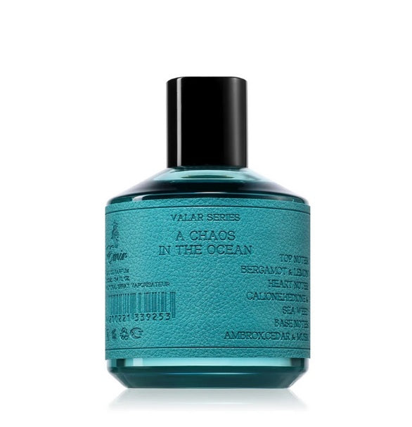 A teal bottle of Paris Corner's Emir Vala Series A Chaos in the Ocean 100ml Eau De Parfum has a textured label detailing its scent notes—a bold, unisex fragrance.