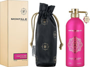 The Montale Paris Crazy In Love 50ml EDP set by Montale Paris includes a beige presentation box, a black logo pouch, and a vibrant pink bottle adorned with gold accents and keychain. This captivating unisex fragrance embodies elegance and passion in every detail.