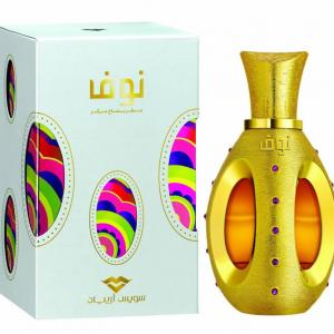 A gold and amber woody perfume bottle with purple gems stands beside a white box with colorful ovals and Arabic text, showcasing Swiss Arabian Nouf Eau De Parfum—a captivating women's fragrance by Swiss Arabian.