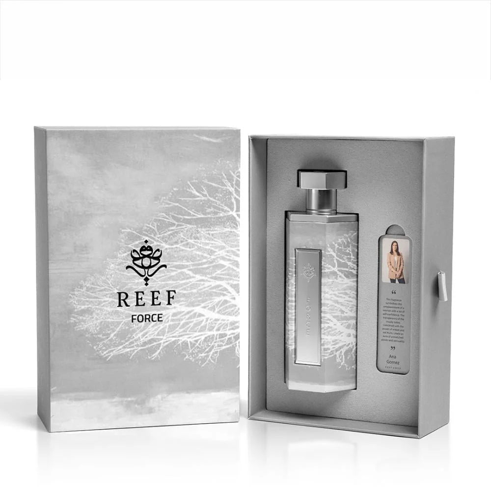 A sleek grey box showcases a Reef Force 200ml EDP bottle by Reef and a small card with an image and text, all elegantly arranged in a tailored package.