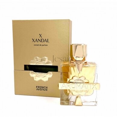 A gold and clear bottle labeled "French Avenue X Xandal Aromatix 100ml Extrait De Parfum" stands before a matching gold box, presenting a luxurious unisex floral fragrance by French Avenue.