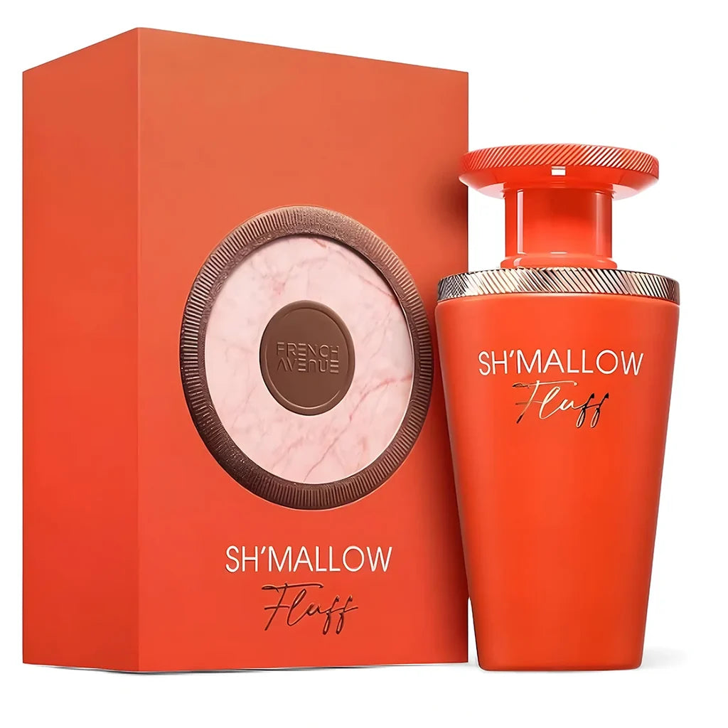 A 100ml bottle of French Avenue Sh’mallow Fluff Eau De Parfum in vibrant orange, paired with a matching round-designed box displaying the French Avenue brand name—this floral fruity gourmand fragrance is as captivating visually as it is enchanting to wear.