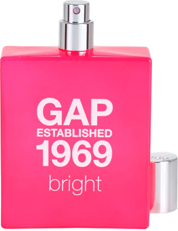 The GAP Established 1969 Bright 50ml Eau De Toilette by Gap features a vibrant pink rectangular bottle with a silver spray cap, offering a lively floral fruity fragrance from the GAP Bright collection.