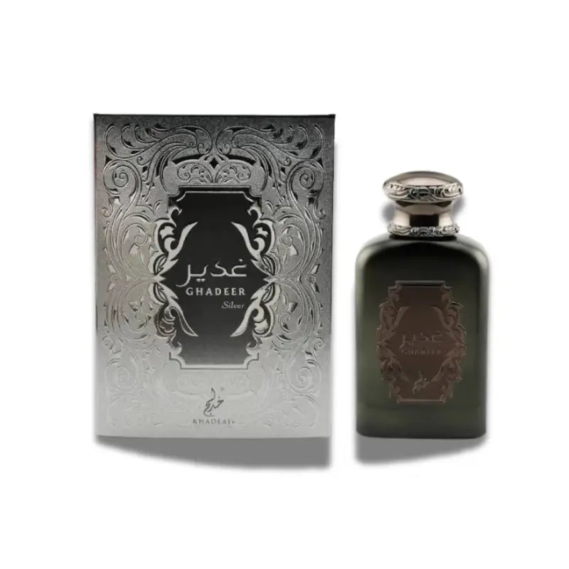 A stylish Khadlaj Ghadeer Silver 100ml EDP perfume box stands beside a matching dark glass bottle with an ornate cap—an elegant unisex fragrance by Khadlaj.