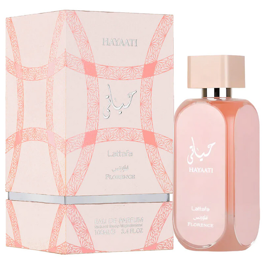 A bottle of Lataffa Hayaati Florence 100ml Eau De Parfum next to its packaging, featuring elegant Arabic script and geometric patterns in pink and white.