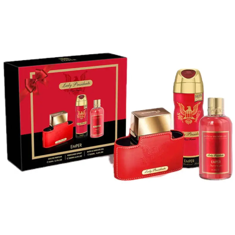 The Emper Lady Presidente Pour Femme 80ml EDP Gift Set by Emper includes a Floral Fruity perfume, deodorant, and body spray in red packaging, all elegantly presented in a black and gold gift box.