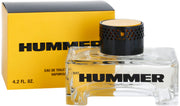 A 125ml bottle of Rio Perfumes Hummer Eau De Toilette is displayed in front of its yellow and black box, with bold black text on the clear bottle highlighting this distinctive men's fragrance.