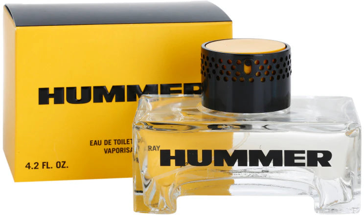 A 125ml bottle of Rio Perfumes Hummer Eau De Toilette is displayed in front of its yellow and black box, with bold black text on the clear bottle highlighting this distinctive men's fragrance.