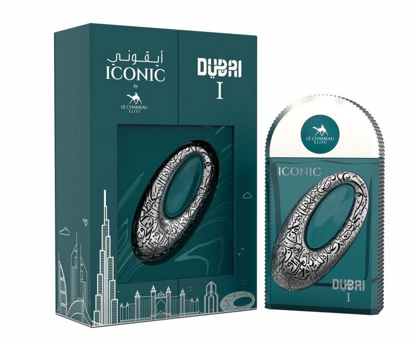 A boxed and unboxed Le Chameau Iconic Dubai I 100ml EDP displays a silver-patterned bottle with teal city skyline packaging, reflecting the vibrant, unisex fragrance of Le Chameau.