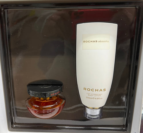 A 50ml bottle of Rochas Absolu Eau de Parfum Gift Set, a fragrance for women, paired with a bottle of honey, all neatly packaged in a box.