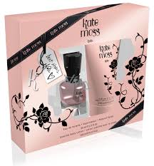 A pink and black "Kate Moss Kate 30ml EDT gift set" by Kate Moss, featuring perfume and body lotion in a floral box with a printed autograph.