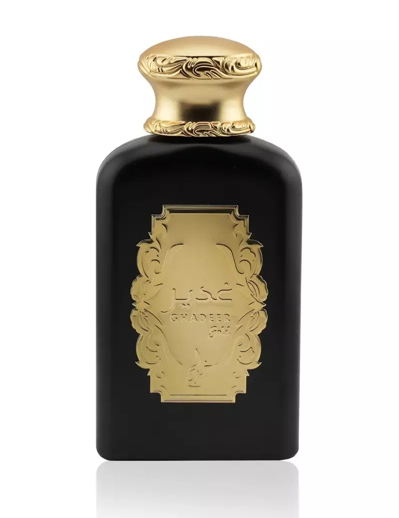 Khadlaj Ghadeer Gold 100ml EDP is a luxurious unisex perfume in a black bottle with an ornate gold cap and label adorned with Arabic script, crafted by Khadlaj to captivate the senses.