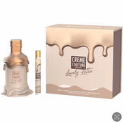 The Emper Creme Couture Lovely Latte 100ml EDP gift set includes a bottle, travel spray, and box with a beige and gold drip design—a unisex fragrance by Emper for any occasion.