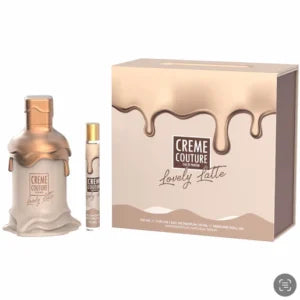 The Emper Creme Couture Lovely Latte 100ml EDP gift set includes a bottle, travel spray, and box with a beige and gold drip design—a unisex fragrance by Emper for any occasion.