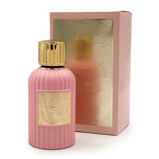 A Paris Corner Qissa Pink Eau De Parfum bottle next to its packaging.