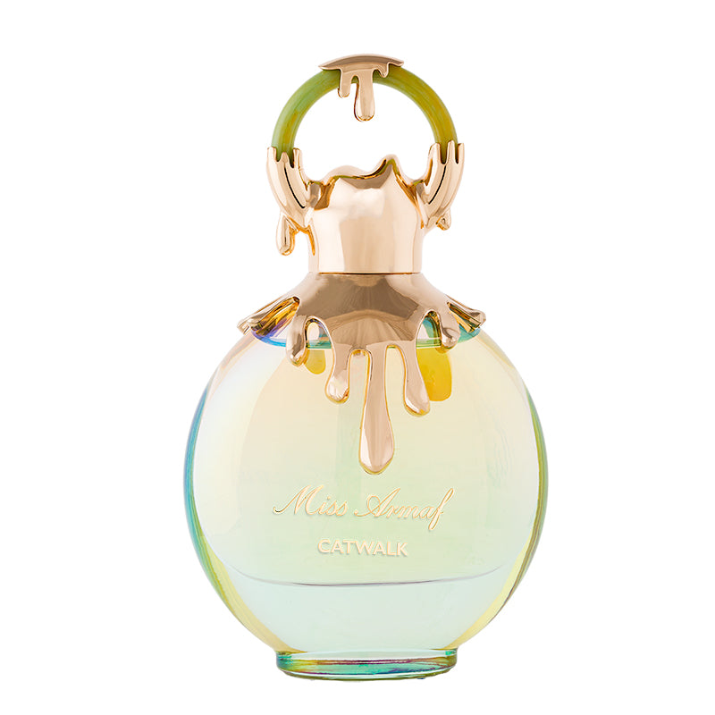 The Armaf Miss Armaf Catwalk 100ml EDP Tester features a round bottle with gold accents and a circular gold and green cap, embodying a luxurious fragrance experience for women.