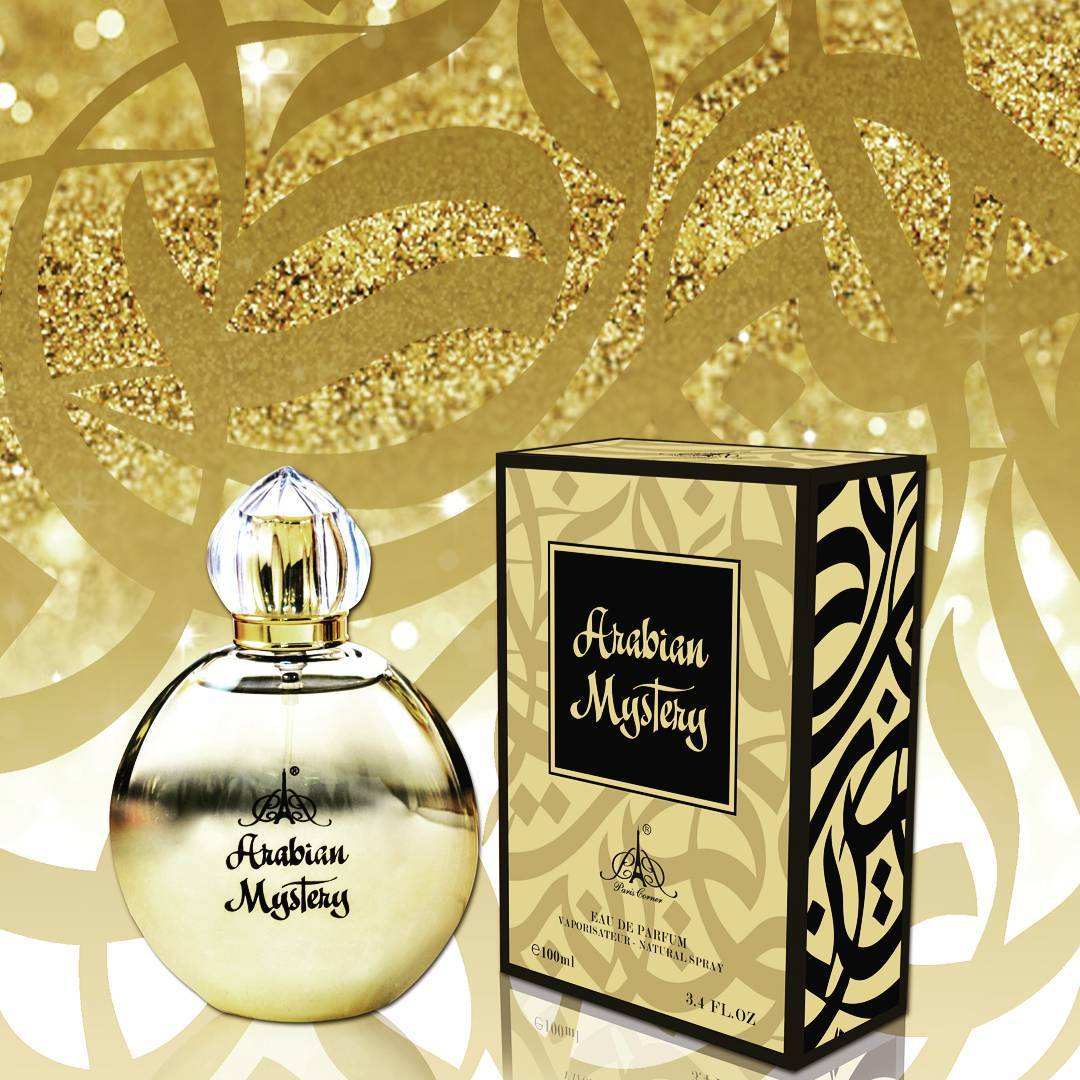 A bottle and box of Dubai Perfumes' Paris Corner Arabian Mystery 100ml Eau De Parfum are displayed against a gold and black patterned background, highlighting the allure of this oriental fragrance.