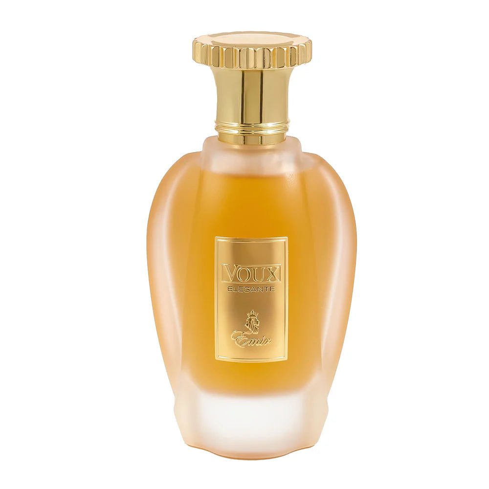 A gold-capped, frosted glass perfume bottle with a gold label reading “VOIX ELEGANTE” and “Eminent” is showcased against a white background. This exquisite Eau De Parfum, Emir Voux Elegante by Paris Corner (100ml EDP), reveals the allure of a refined Woody Aromatic fragrance.