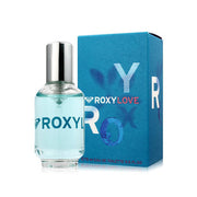 A 100ml bottle of Quicksilver Roxy Love Eau De Toilette, an Aromatic Aquatic scent, is placed next to its blue box displaying the Quicksilver logo and product name.